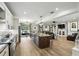 Spacious open-concept living room with hardwood floors, a fireplace, and ample natural light at 6346 Dallas Blvd, Orlando, FL 32833