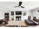 Cozy living room featuring plush leather seating, entertainment center, and stylish decor at 6346 Dallas Blvd, Orlando, FL 32833