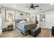 Spacious primary bedroom suite with a king bed, ceiling fan and doorway to the bathroom at 6346 Dallas Blvd, Orlando, FL 32833