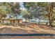 Swing into fun at the playground with sturdy swings, surrounded by mature trees and a well-maintained wood chip ground at 6346 Dallas Blvd, Orlando, FL 32833