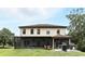 Spacious two-story home featuring a large, screened-in patio, a grill area, and a well-maintained lawn at 6346 Dallas Blvd, Orlando, FL 32833