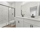 Modern bathroom featuring a double vanity, black fixtures, and sleek glass shower at 709 Marion Oaks Mnr, Ocala, FL 34473
