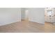 Bright bedroom with wood-look flooring, ensuite bath, and closet at 709 Marion Oaks Mnr, Ocala, FL 34473