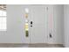 A minimalist front door design with sidelights, a digital lock, and views of the home's surroundings at 709 Marion Oaks Mnr, Ocala, FL 34473