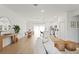 Bright, open living space features modern decor, a dining area, and wood-look flooring at 709 Marion Oaks Mnr, Ocala, FL 34473