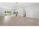Bright, open-concept space showcasing the kitchen with an island and stainless steel appliances adjacent to the living area at 709 Marion Oaks Mnr, Ocala, FL 34473
