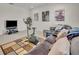 Finished basement with a cozy entertainment area, exercise equipment, and unique decor for a versatile space at 7895 Pleasant Pine Cir, Winter Park, FL 32792