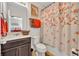 Bathroom featuring a single sink, toilet, shower, and decorative shower curtain at 7895 Pleasant Pine Cir, Winter Park, FL 32792