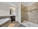 Bright bathroom featuring a corner tub, double sinks, and a separate shower at 7895 Pleasant Pine Cir, Winter Park, FL 32792