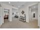 Bright hallway offers a seamless transition between rooms with neutral tones and modern decor at 7895 Pleasant Pine Cir, Winter Park, FL 32792