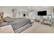 Spacious main bedroom featuring neutral colors, carpet floors, and an entertainment area at 7895 Pleasant Pine Cir, Winter Park, FL 32792