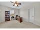 Bright office space with a large window, desk, and built-in shelving at 7895 Pleasant Pine Cir, Winter Park, FL 32792