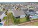 Aerial view of a two-story house in a suburban neighborhood with a fenced backyard and pool at 840 Livestock Loop, St Cloud, FL 34771