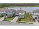 Aerial view of a lovely home near a serene lake, showcasing the neighborhood's peaceful setting at 840 Livestock Loop, St Cloud, FL 34771