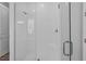 Modern bathroom featuring a glass shower with white subway tile and a built-in bench at 840 Livestock Loop, St Cloud, FL 34771