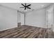 An unfurnished bedroom features modern floors, plenty of sunlight, and ample closet space at 840 Livestock Loop, St Cloud, FL 34771