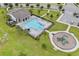 Aerial view of the community pool with a playground, perfect for Gathering fun and recreation at 840 Livestock Loop, St Cloud, FL 34771