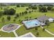 Aerial view of the community pool with a playground, offering a perfect place for Gathering fun and recreation at 840 Livestock Loop, St Cloud, FL 34771