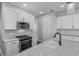 Modern kitchen with stainless steel appliances, granite countertops, and ample cabinet space at 840 Livestock Loop, St Cloud, FL 34771