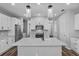 Bright kitchen featuring a center island with countertop seating and pendant lighting at 840 Livestock Loop, St Cloud, FL 34771