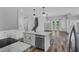 Bright kitchen with stainless steel appliances, center island, and seamless flow into the living area with lake view at 840 Livestock Loop, St Cloud, FL 34771