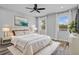 Serene main bedroom showcasing a plush bed, soft rug, natural light, and stylish decor at 840 Livestock Loop, St Cloud, FL 34771