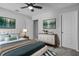 Beautiful primary bedroom with stylish decor, a large bed, and ample natural light at 840 Livestock Loop, St Cloud, FL 34771