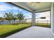 Covered patio, with a view of the fenced yard and lake at 840 Livestock Loop, St Cloud, FL 34771