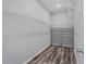 A well-organized walk-in closet with white wire shelving and dark wood-look flooring at 840 Livestock Loop, St Cloud, FL 34771