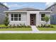 Charming single-story home featuring a modern front door and well-maintained landscaping at 9528 Archway Aly, Orlando, FL 32832