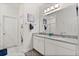 Bathroom with granite countertops, dual sinks, and decorative accents at 9814 Amber Chestnut Way, Winter Garden, FL 34787