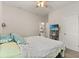 Bright bedroom showcasing a TV and ensuite bathroom entrance at 9814 Amber Chestnut Way, Winter Garden, FL 34787