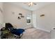 Cozy bedroom with chair, side table, and a ceiling fan offers a relaxing retreat at 9814 Amber Chestnut Way, Winter Garden, FL 34787