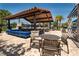 Community clubhouse with outdoor kitchen, seating area and pool access at 9814 Amber Chestnut Way, Winter Garden, FL 34787