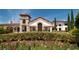 Beautiful clubhouse with stone accents and lush landscaping at 9814 Amber Chestnut Way, Winter Garden, FL 34787