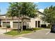 Exterior view of the property, showcasing a well-maintained facade and attached garage at 9814 Amber Chestnut Way, Winter Garden, FL 34787