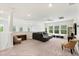 Spacious living room with lots of natural light and modern furniture at 9814 Amber Chestnut Way, Winter Garden, FL 34787