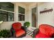 Charming outdoor patio featuring cozy seating and a welcoming entrance to the home at 9814 Amber Chestnut Way, Winter Garden, FL 34787