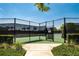 Fenced tennis court provides a great outdoor recreational space at 9814 Amber Chestnut Way, Winter Garden, FL 34787