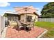 Lovely backyard with brick patio, seating, grill, and white privacy fence at 999 Mancha Real Dr, Orlando, FL 32807
