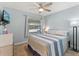 Cozy bedroom with a ceiling fan, tile flooring and a window that provides great natural light at 999 Mancha Real Dr, Orlando, FL 32807