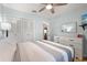 Bedroom featuring a ceiling fan, closet with bi-fold doors, and tiled floors at 999 Mancha Real Dr, Orlando, FL 32807