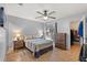 Cozy bedroom with tile floors, a ceiling fan, and window and leads to a walk-in closet at 999 Mancha Real Dr, Orlando, FL 32807