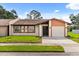 Charming single-story home with well-manicured lawn, neutral paint scheme, and attached one car garage at 999 Mancha Real Dr, Orlando, FL 32807