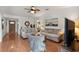 Bright living room with neutral-toned sofas, wood floors, a ceiling fan and an open entry at 999 Mancha Real Dr, Orlando, FL 32807