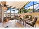 Screened patio with tile flooring and an outdoor seating area at 999 Mancha Real Dr, Orlando, FL 32807