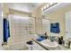 Well-maintained bathroom with a shower-tub combo, vanity, and bright overhead lighting at 1019 Lake Berkley Dr, Kissimmee, FL 34746