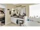 Well-lit bathroom featuring dual vanity, a soaking tub with a large window, and ample storage at 1019 Lake Berkley Dr, Kissimmee, FL 34746