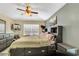 Comfortable bedroom featuring a full bed, stylish decor, and plenty of natural light from the window at 1019 Lake Berkley Dr, Kissimmee, FL 34746