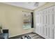 Spare bedroom featuring a large closet and backyard views, providing ample space at 1019 Lake Berkley Dr, Kissimmee, FL 34746